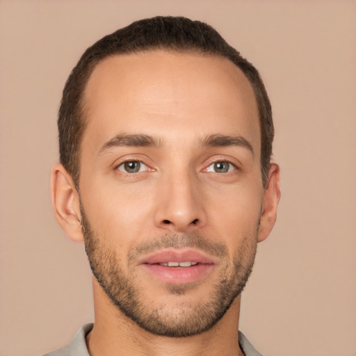 Joyful white young-adult male with short  brown hair and brown eyes