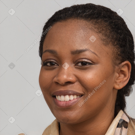 Joyful black young-adult female with medium  brown hair and brown eyes