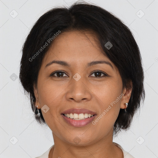 Joyful latino young-adult female with medium  brown hair and brown eyes