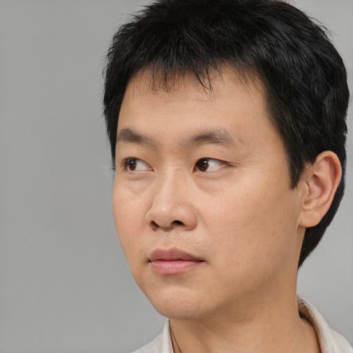 Neutral asian young-adult male with short  black hair and brown eyes