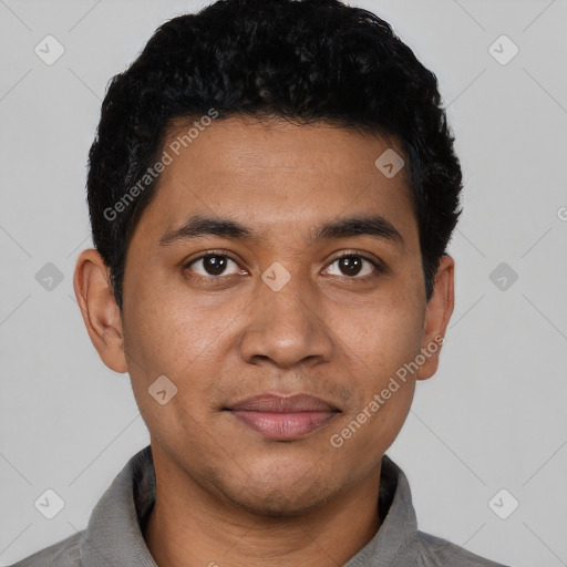 Joyful latino young-adult male with short  black hair and brown eyes