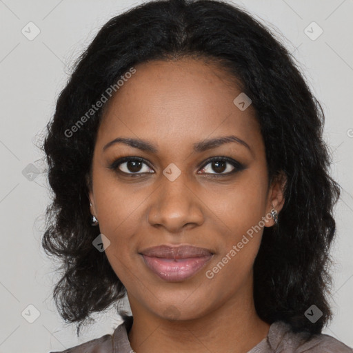 Joyful black young-adult female with long  brown hair and brown eyes