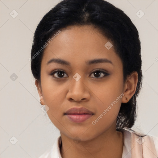 Joyful latino young-adult female with short  black hair and brown eyes