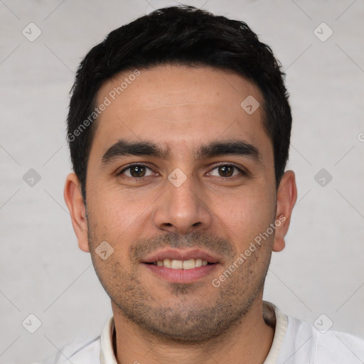 Joyful white young-adult male with short  black hair and brown eyes