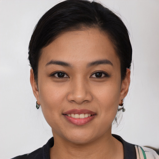 Joyful white young-adult female with medium  black hair and brown eyes