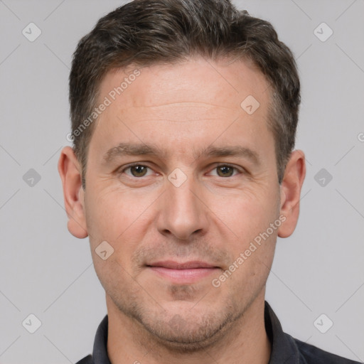 Joyful white adult male with short  brown hair and grey eyes