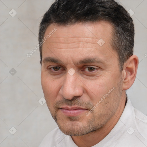 Joyful white adult male with short  brown hair and brown eyes