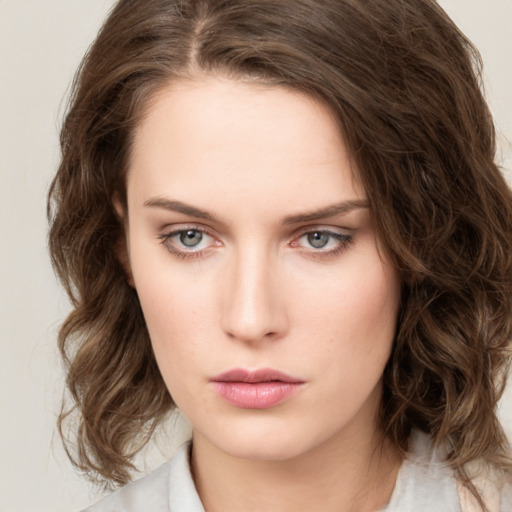 Neutral white young-adult female with medium  brown hair and green eyes