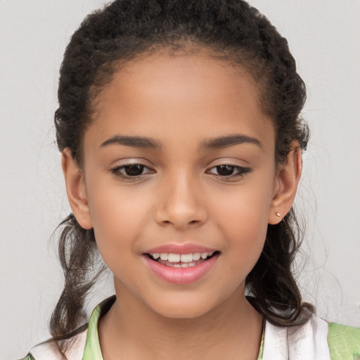 Joyful white child female with long  brown hair and brown eyes