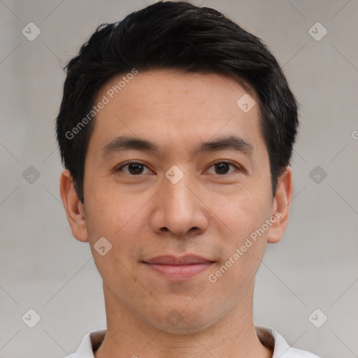 Joyful white young-adult male with short  black hair and brown eyes