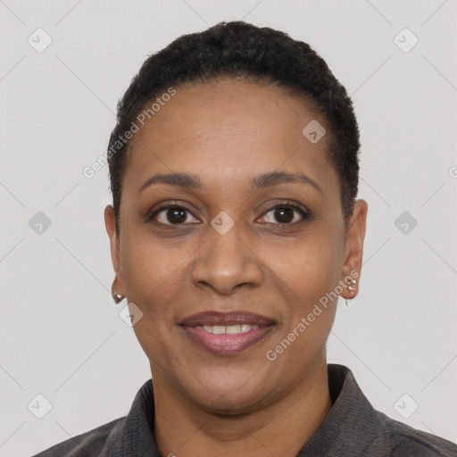 Joyful black adult female with short  black hair and brown eyes