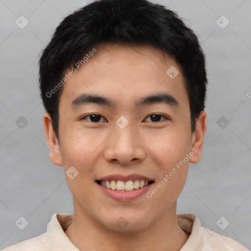 Joyful asian young-adult male with short  black hair and brown eyes