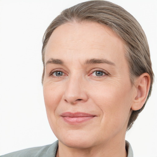 Joyful white adult female with short  brown hair and grey eyes