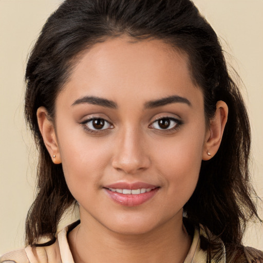 Joyful white young-adult female with long  brown hair and brown eyes