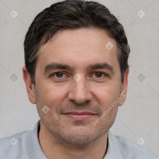 Joyful white adult male with short  brown hair and brown eyes