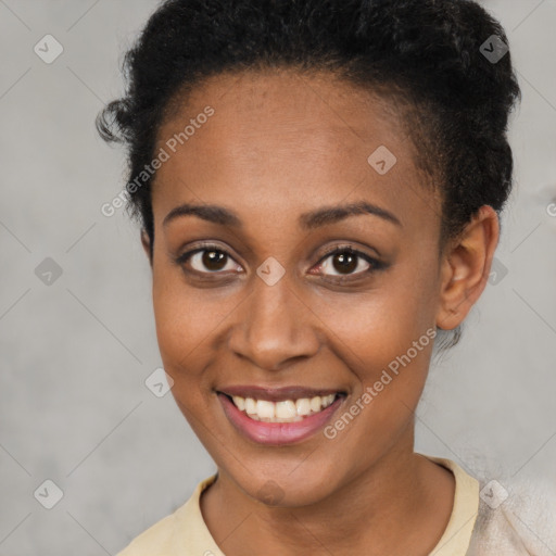 Joyful black young-adult female with short  brown hair and brown eyes