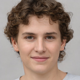 Joyful white young-adult male with medium  brown hair and brown eyes