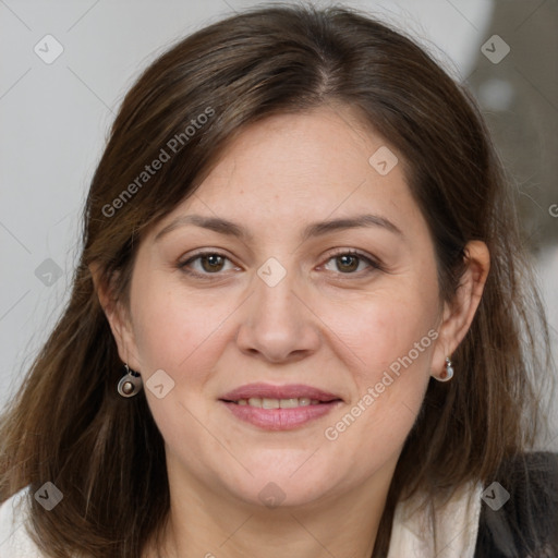 Joyful white adult female with medium  brown hair and grey eyes