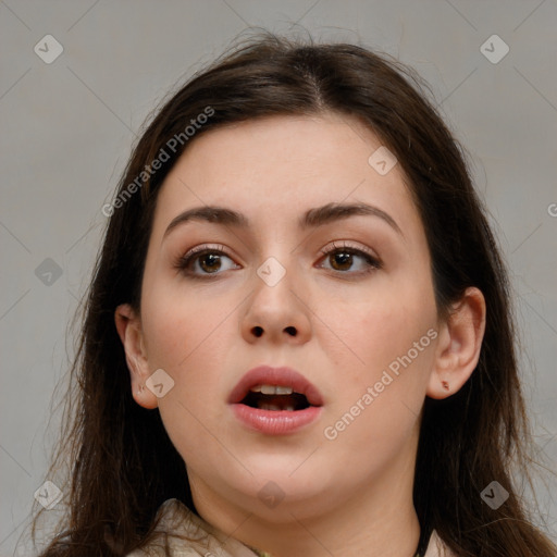 Neutral white young-adult female with long  brown hair and brown eyes