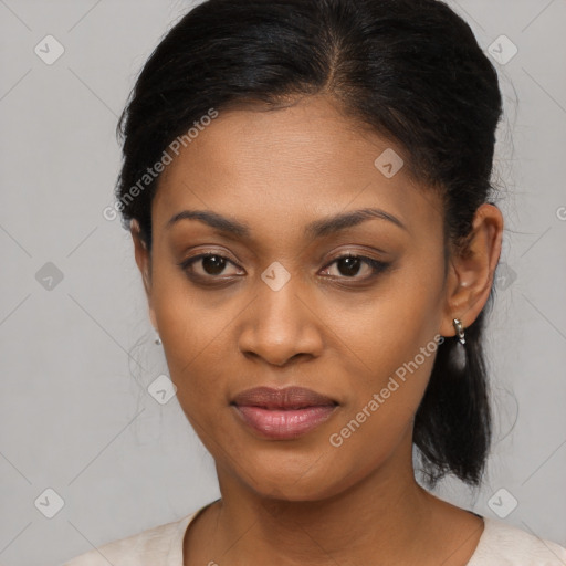 Joyful black young-adult female with medium  black hair and brown eyes