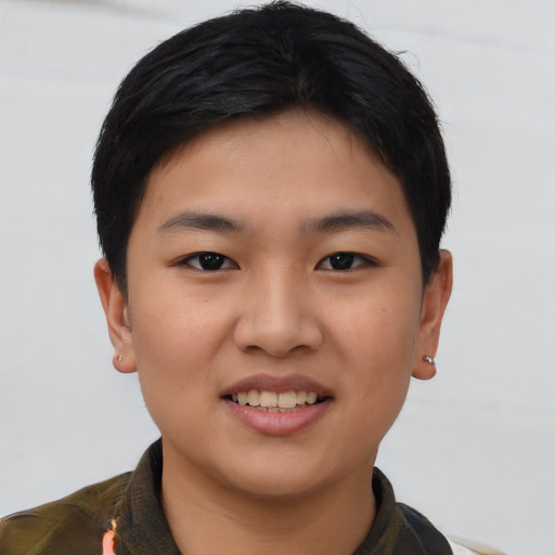 Joyful asian young-adult female with short  brown hair and brown eyes