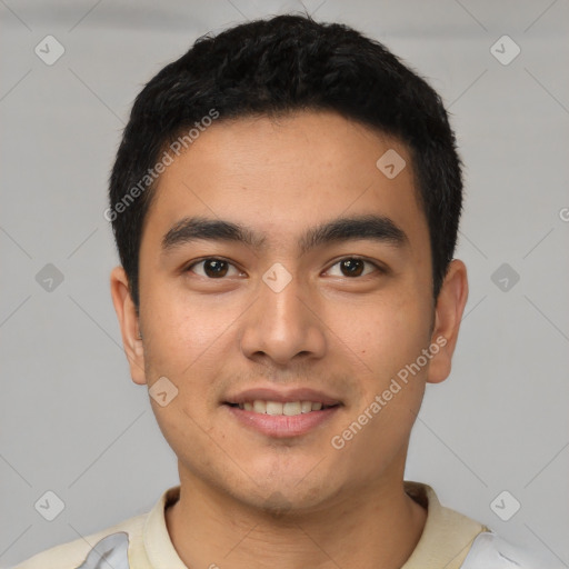 Joyful latino young-adult male with short  black hair and brown eyes