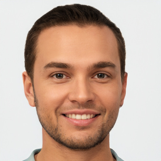 Joyful white young-adult male with short  brown hair and brown eyes