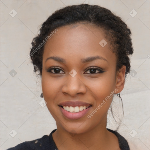 Joyful black young-adult female with long  black hair and brown eyes