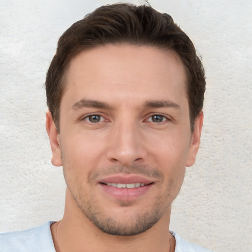 Joyful white young-adult male with short  brown hair and brown eyes