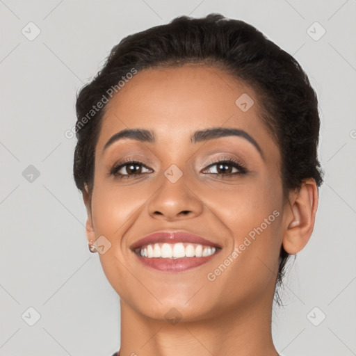 Joyful latino young-adult female with short  black hair and brown eyes