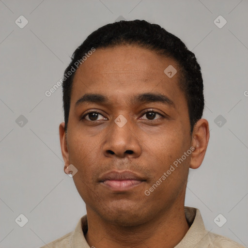 Neutral latino young-adult male with short  black hair and brown eyes