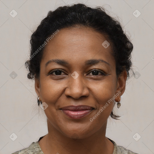 Joyful black adult female with short  brown hair and brown eyes