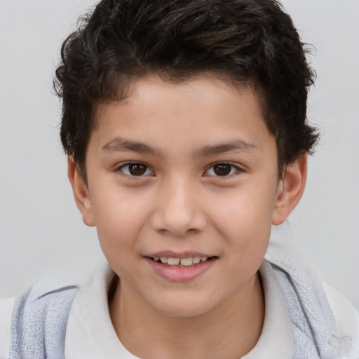 Joyful white child male with short  brown hair and brown eyes