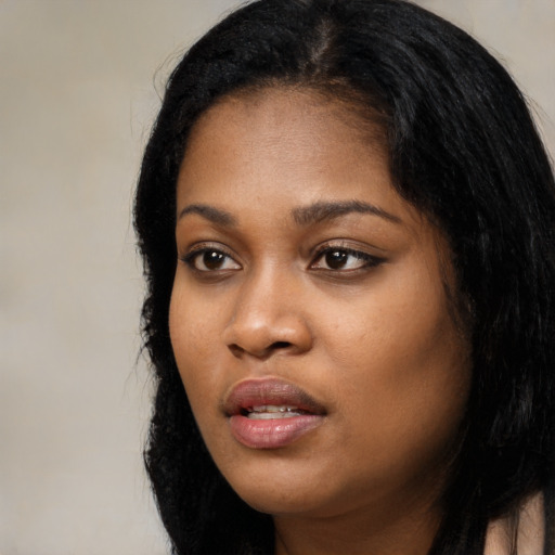 Neutral black young-adult female with long  black hair and brown eyes