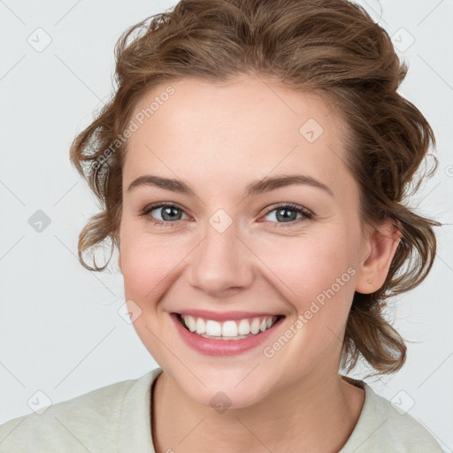 Joyful white young-adult female with medium  brown hair and blue eyes