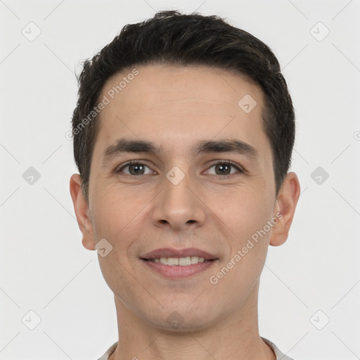 Joyful white young-adult male with short  black hair and brown eyes