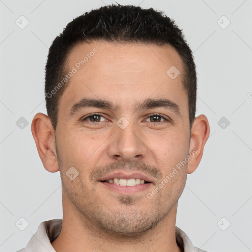 Joyful white young-adult male with short  brown hair and brown eyes