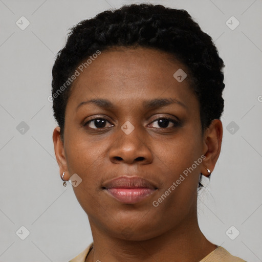 Joyful black young-adult female with short  black hair and brown eyes