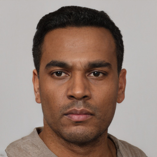 Neutral latino young-adult male with short  black hair and brown eyes