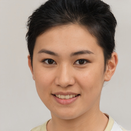 Joyful asian young-adult female with short  brown hair and brown eyes