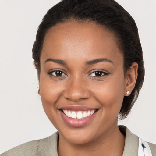 Joyful latino young-adult female with short  brown hair and brown eyes