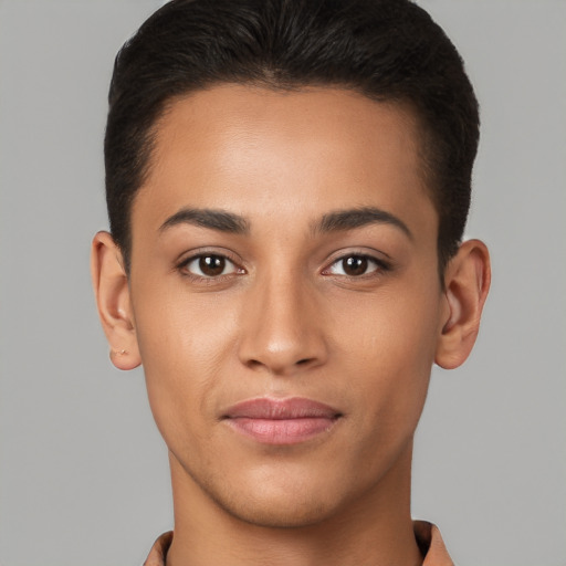 Joyful latino young-adult male with short  brown hair and brown eyes