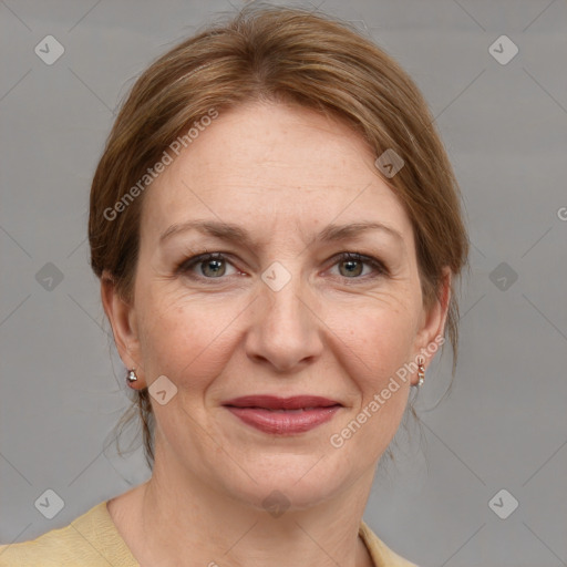 Joyful white adult female with medium  brown hair and grey eyes