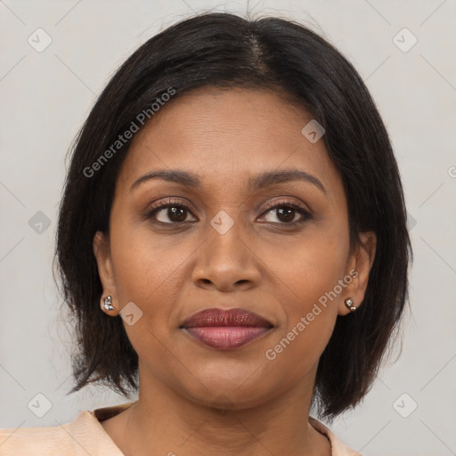 Joyful black adult female with medium  brown hair and brown eyes