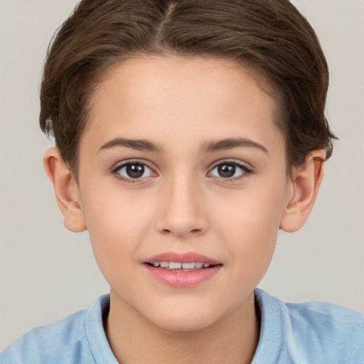 Joyful white child female with short  brown hair and brown eyes