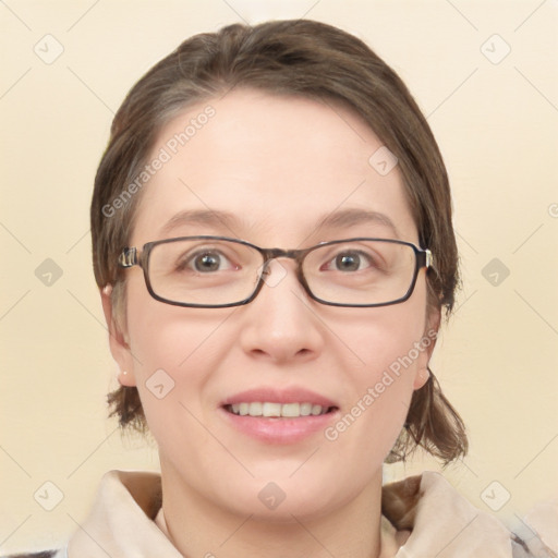 Joyful white young-adult female with medium  brown hair and green eyes