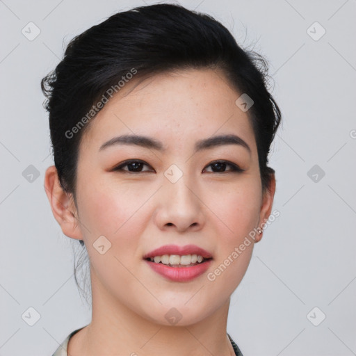 Joyful asian young-adult female with short  black hair and brown eyes