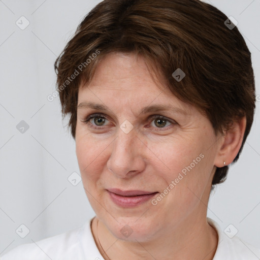 Joyful white adult female with short  brown hair and brown eyes