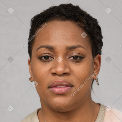 Joyful black young-adult female with short  black hair and brown eyes