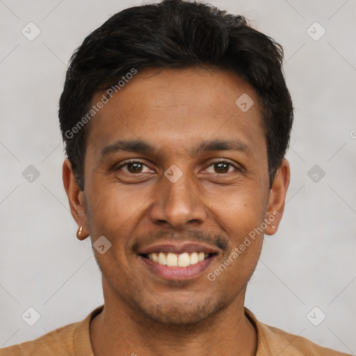 Joyful latino young-adult male with short  black hair and brown eyes